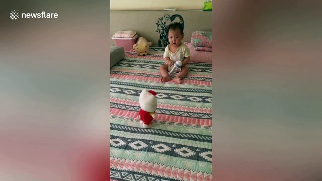 Chinese baby gets scared by voice-activated toy