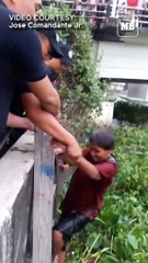 Intrepid policeman goes into Pasig river to rescue elderly woman