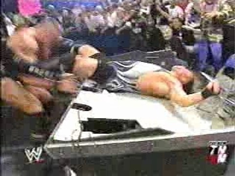 WWE - Brock Lesnar Powerbombs RVD through Announce Table