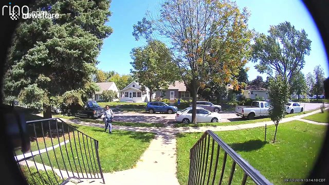US Postal Service courier tosses Amazon package across homeowner's front lawn