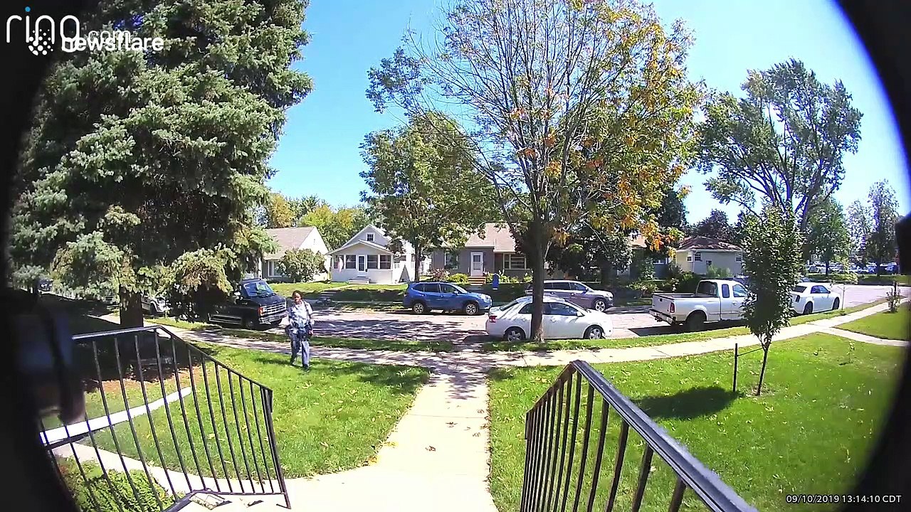 US Postal Service courier tosses Amazon package across homeowner's front lawn