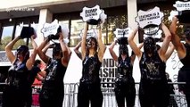 PETA activists cover themselves in 'toxic slime' during protest at London Fashion Week