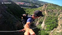 Daredevil performs extremely dangerous stunt by carrying dog across highline in Georgia