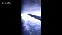Spectacular lightning storm captured from plane window flying over US