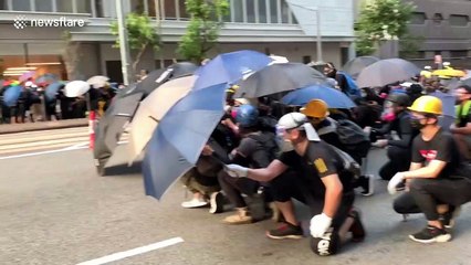 Hong Kong protesters advance on police lines in Wan Chai