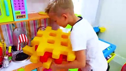 Vlad and Nikita play with color blocks of toys