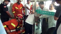 Chinese firemen free six-year-old boy's head from glass doors