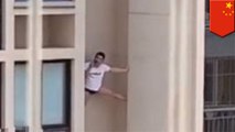 Man spideys high-rise while talking on his phone