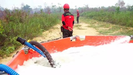 Fire task force in Indonesia extinguishes burning peatlands to combat haze crisis