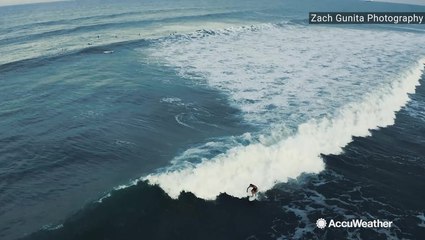 Surfer takes advantage of Humberto churning off the coast