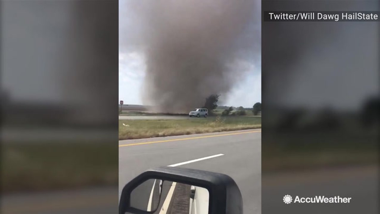 Massive dust devil sweeps onto road