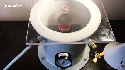 Ukrainian scientist makes bottle of Coca-Cola bubble over using vacuum
