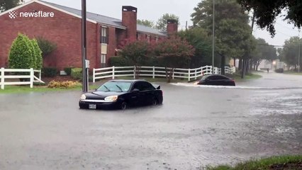 Cars and communities in Houston ravaged by high water from Tropical Depression Imelda