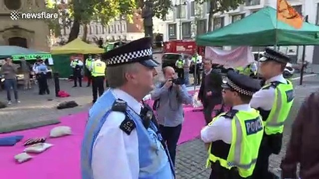 Police in London arrest Extinction Rebellion protesters reciting prayers