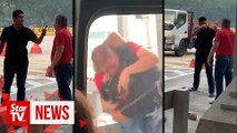 Two men in viral toll fight video get one-day jail, RM1,000 fine each