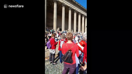 Protesters rally around St George’s Hall in Liverpool to take a stance against climate change