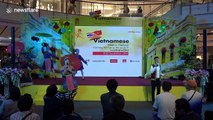 Vietnamese dancers perform traditional music show in colourful costumes