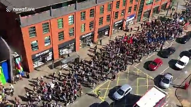 Thousands of climate change activists seen lining the streets of Manchester