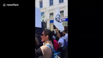 Climate change protesters march through Brighton streets with banners in hand