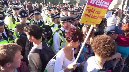 Scuffles as climate change protesters CLASH with police in London
