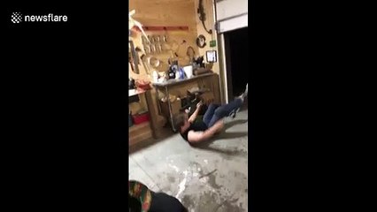 Man loses both balance and beer attempting to balance on board while shotgunning a beer