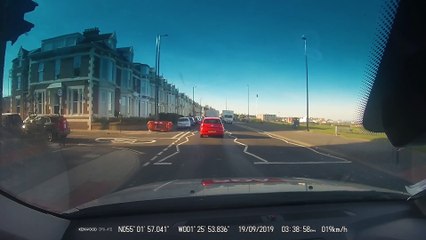 Car Collides with Cyclist in Roundabout