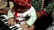 5 months boy playing piano