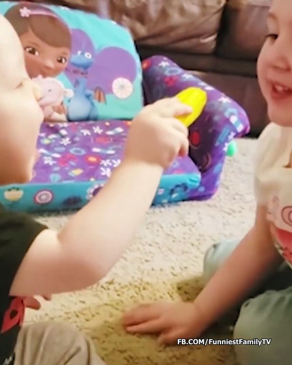 Funny babies playing together