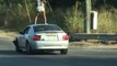 Girl Stands on Top of Moving Car and Twerks
