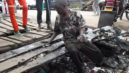 Man in Kenya sifts through knee-deep waste to clear out plastic