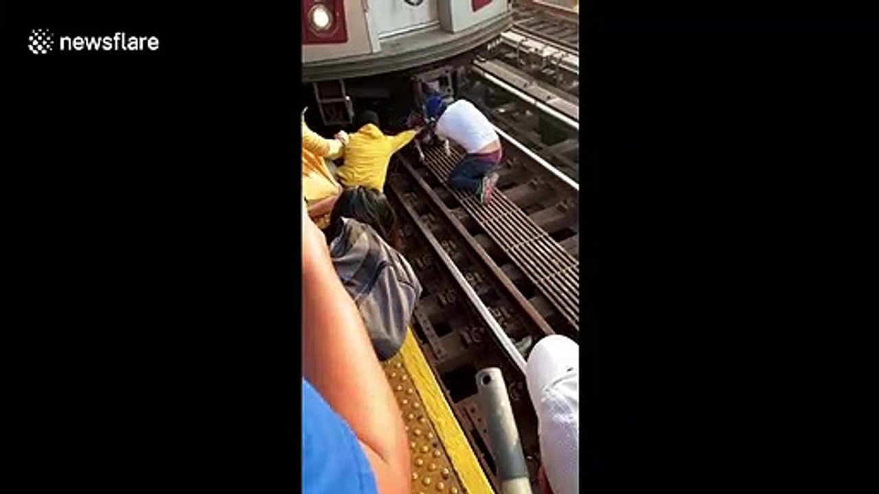 Bystanders in New York rescue girl from train tracks after dad's suicide