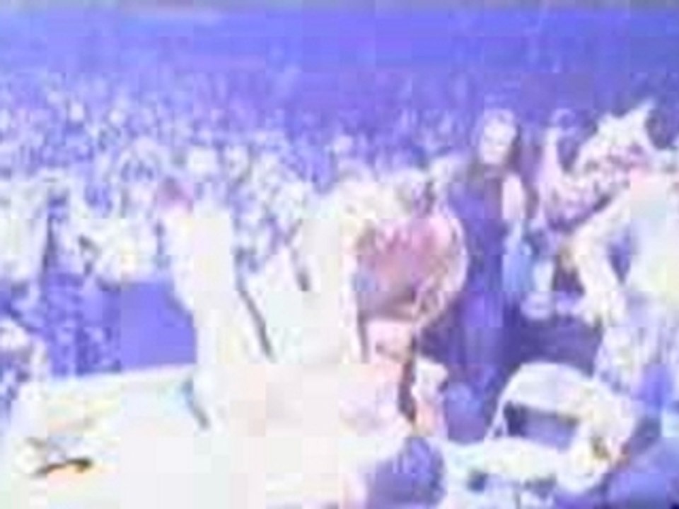 WWE - Big Show chokeslams the Rock through the announce tabl