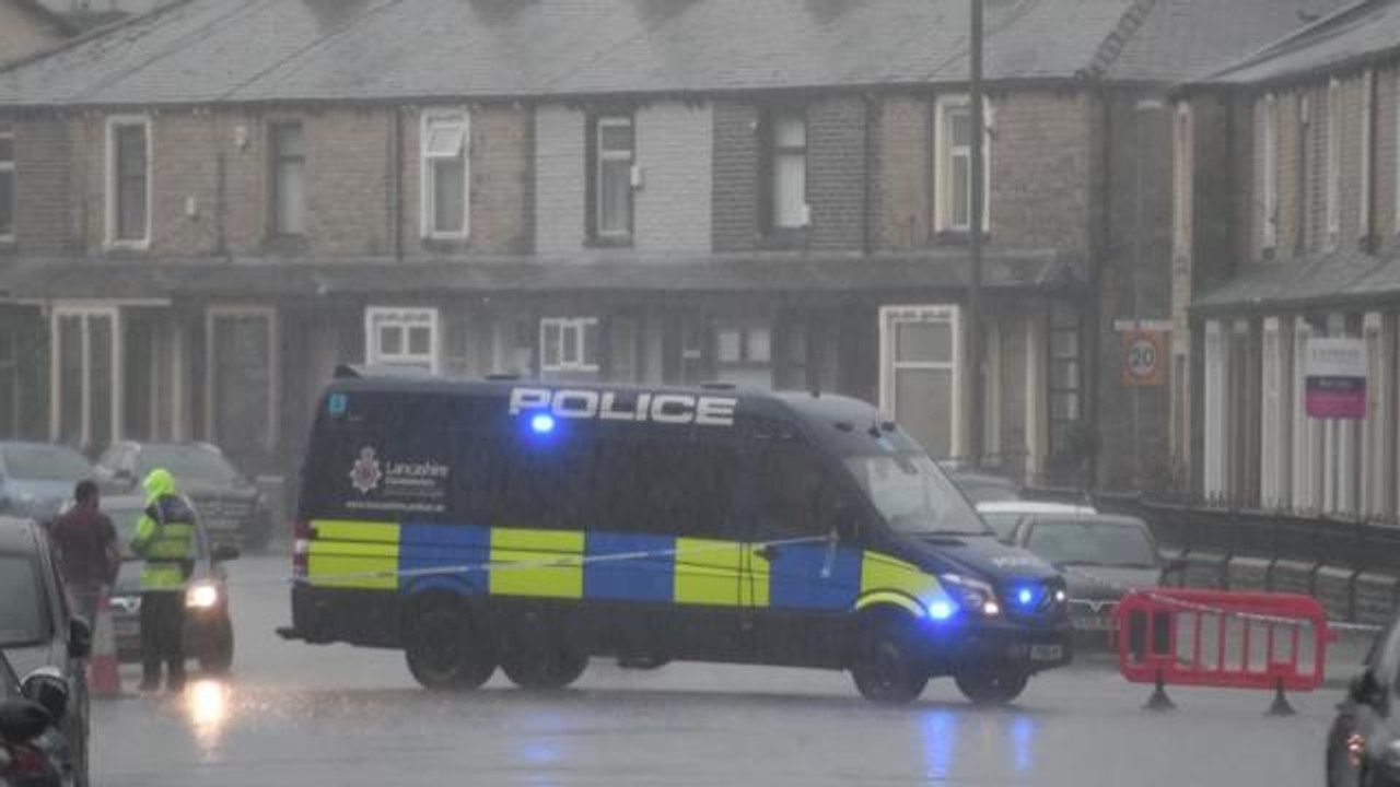 Police cordon off roads as bomb squad officers...