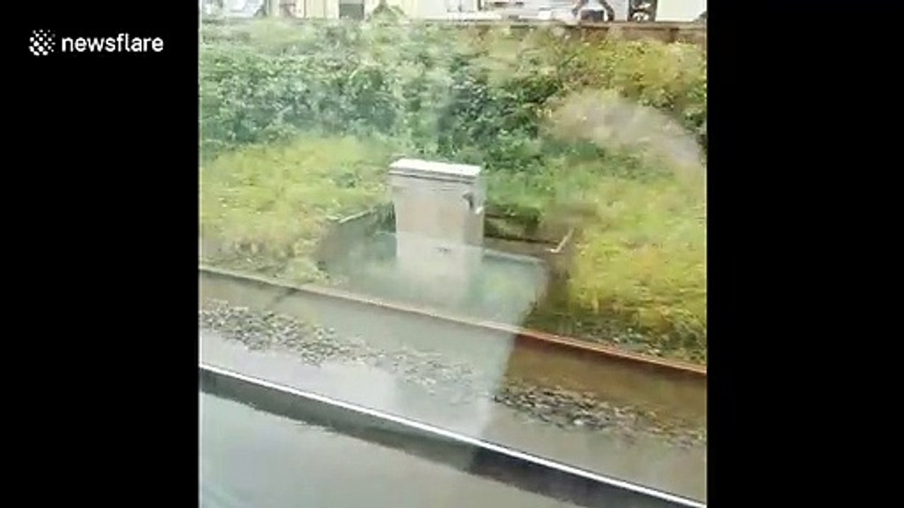 UK train slows to a crawl as floodwaters swamp tracks