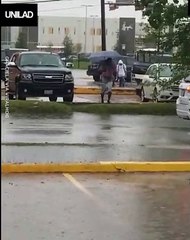 Woman Walks Through Car Park And Falls In Puddle