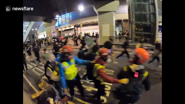 Hong Kong police disperse crowds with water cannon on 5th anniversary of umbrella movement