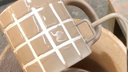 This artist creates invisible designs on pottery with wax