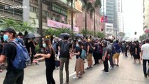 Resourceful Hong Kong activists form human chain to pass supplies to the front line of protest