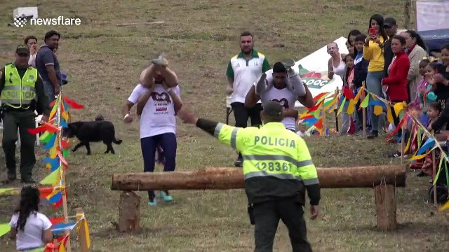 Colombia's first wife-carrying championship sees contestants navigate 700m course