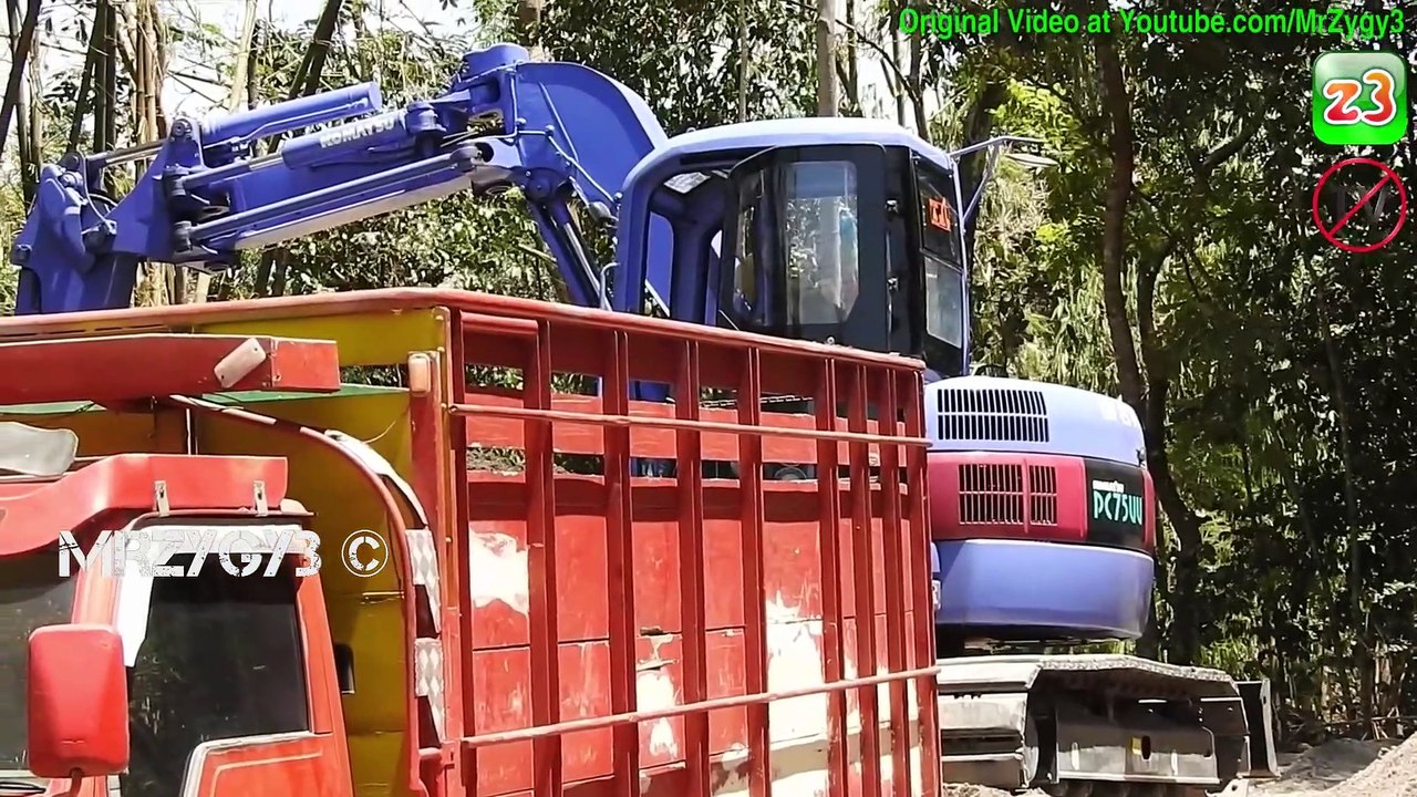 Mini Excavator Girl Operator Loading Sand Into Trucks Komatsu PC75UU