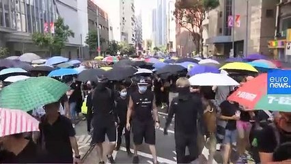 Hong Kong police shoot young protester at close range