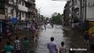 Floodwaters sweep through city after days of monsoon rain