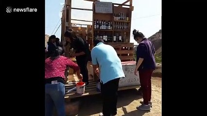 Chilean students paint greenhouse made from community waste