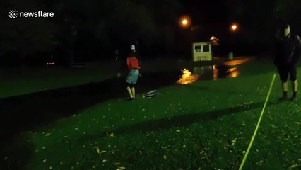 Man rides skimboard in flooded field in Canada