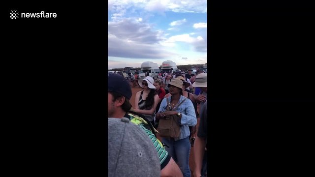 Thousands flock to Uluru for final chance to scale the sacred rock before climbing ban is enforced