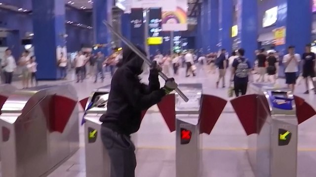 Hong Kong protesters vandalise businesses and MTR stations in angry response to shooting of school pupil during National Day clashes