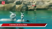 Su altında Pir Sultan Abdal ve Hacı Bektaş-ı Veli heykelleri