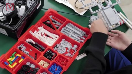 Watch an Inspiring Teacher Show Students How to Build Robots Using LEGO Kits