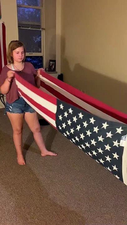 Girls Folding the Flag