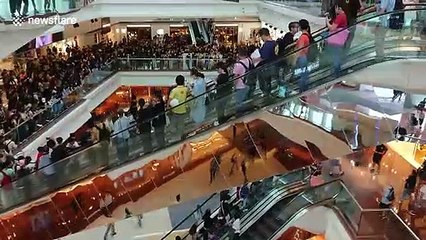 Protesters chant in Hong Kong mall against new anti-mask law